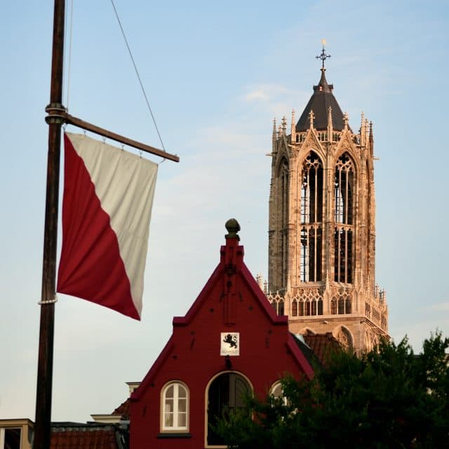 Dom Tower with a red and white flag typical for Utrecht